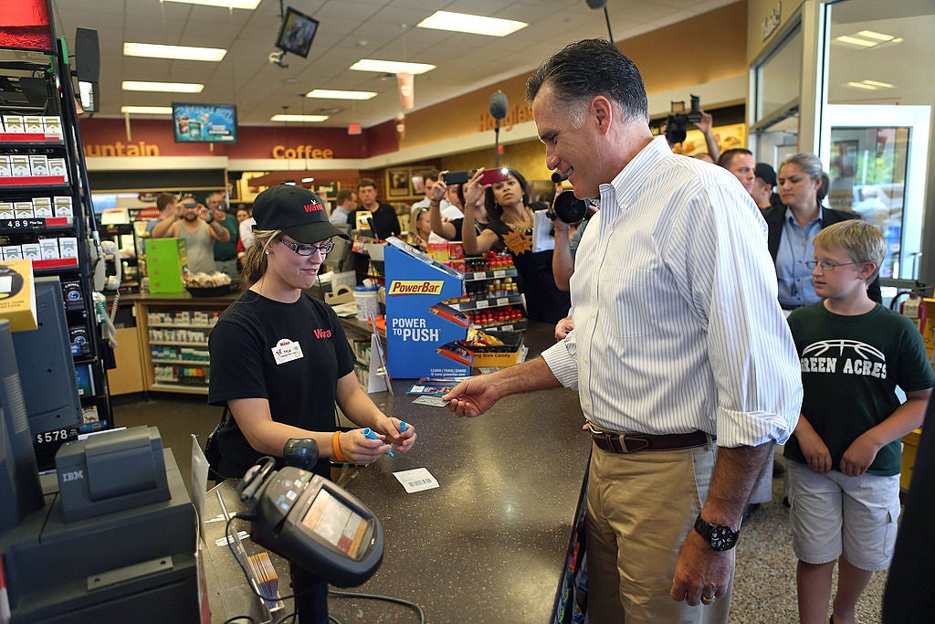 Man at the counter at Wawa, cashier ringing him up